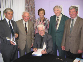 Dean Norman Barr pictured signing copies of his new book last Thursday evening (29th June) at Christ Church, Derriaghy. Included in the photo is L to R: John Williams, Canon James Musgrave, Winifred Bell, Stanley Bell and Leonard Jarvis.