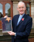 The Rev Brian Gibson is pictured showing a poster advertising the 2006 Carols in the City Concert to be held in the Lisburn Civic Centre on Wednesday 13th December at 7.30pm.