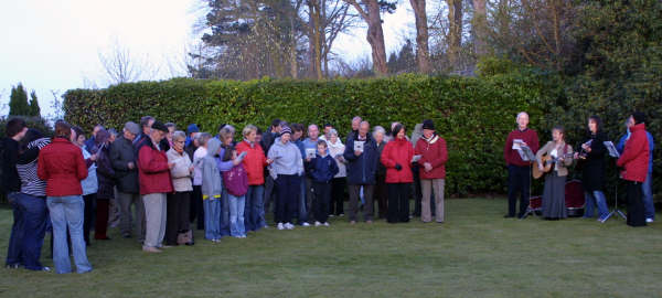 The Rev Brian Gibson and members of Railway Street Presbyterian Church pictured during their annual Easter Sunday Dawn Service, held this year in the manse garden.