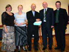 Canon Cochrane is presented with a gift on behalf of the congregation by Mr Wesley Dickinson - Rector?s Warden. L to R: Mrs Ann Elliott, Mrs Mildred Cochrane, Canon Cochrane, Mr Wesley Dickinson and the Rev Paul Dundas.
