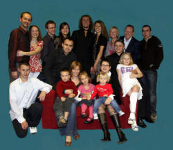 At the special service on Sunday 21st October marking the first anniversary of Lisburn's Polish Mission Church are L to R: (back row) Lukasz and Kamila Nowiccy, Przemek Feliga and Monika Borek, Szczepan and Kamila Cackowscy, Brian and Mary Agnew (Kingdom Life) and Mariusz Borek. Front row: Marcin Cichy (left) and Marcin and Ewa Szlachta and their children Piotrek and Magda and Slawek and Kasia Cichy and their children Oliwia and Paulina (seated on the settee).