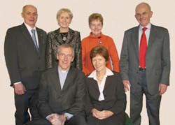 Pictured after presenting gifts to the Very Rev John Dinnen and Mrs Jane Dinnen (seated) are L to R: (back row) Kenny Dougherty (Sexton), Angela Ballentine (Rector's Churchwarden), Elizabeth Bell (People's Churchwarden) and Robert Lucas (Select Vestry).