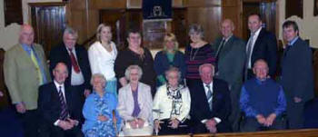 Former caretaker Mrs Ella McIlroy (2nd from left) and former Principal - Mrs Elsie Thompson (4th from left) pictured some past pupils.