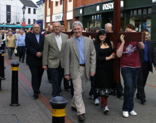 The annual Good Friday 'Carrying of the Cross' march of witness makes its way along Bow Street, Lisburn. 