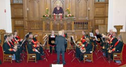 Eileen Mol (Compere) is pictured introducing Noel Roy (Conductor) and Symington Memorial Silver Band.