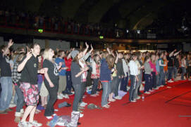 Some of the 4,500 young people who packed the King�s Hall for morning worship at Summer Madness.