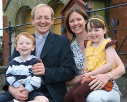 Rev Colin Gracie pictured with his wife Anita and family.