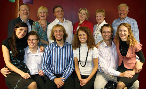 At Lisburn�s Polish Mission Church second birthday party are L to R. (seated) Monika and Przemyslaw Feliga, Szczepan and Kamila Cackowscy and Lukasz and Kamila Nowicki. (back row) Brian and Mary Agnew (Kingdom Life), Slawomir and Katarzyna Cichy and Elizabeth and Mervyn Gilpin (Founder members).