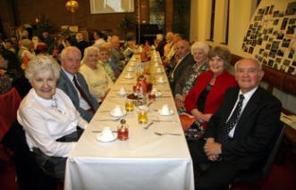 Enjoying the 30th Anniversary Dinner are Jim and Sally McBride, Ria Sloan and Edith Greer (left) and Rev Fergus Bell (Pastor from 1991 to 1996) and his wife Norma and David and Sarah Seeds (right).