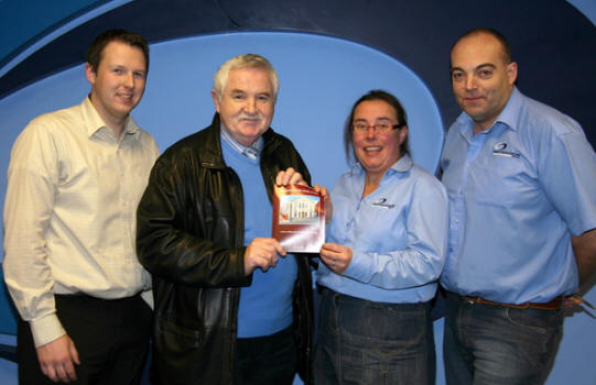 At the handover of the final copy of the book are L to R: Andrew Smyth - Studio Manager, John Kelly, Yvonne Campbell - Designer and Adrian Glenn - Managing Director of Impression Print and Design.