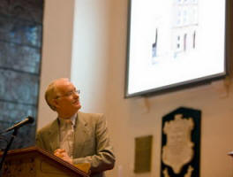 The Rev Brian Gibson is pictured giving a powerpoint presentation showing pictures from the book.