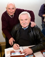 Electrician Raymond Spence, a member of Congregational Committee, gets a book signed. Former electrician Raymond donated and installed floodlighting at the front of the church in 1996 greatly enhanced the beauty of the church building on dark evenings.