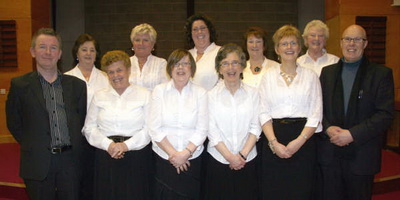 Accompanist Colum McGarry (left) and St Patrick'
s Choir.