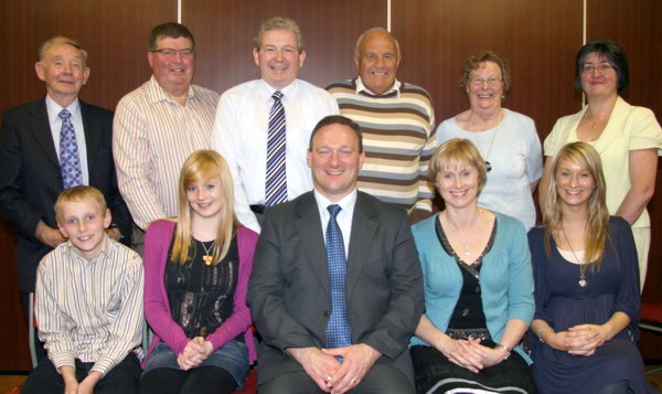 L to R: (seated) The Glasgow family L to R: Jonathan, Lydia, Rev Gary Glasgow, Mrs Zoe Glasgow and Sarah. (back row) Anahilt Presbyterian Church elders - Mr Rex McClelland (Clerk of Session), Mr Noel Graham (Treasurer), Mr. John Magee. Oswald Copes, Miss Lena Stevenson and Mrs Rosemary Nesbitt (Joint Secretaries). Missing from the photo is Mr William Graham. 