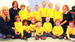 Leaders Abigail Bittle and Debbie Reid (left) and Laura Bittle (right) pictured with the Cabin Boys at the Centenary Display.