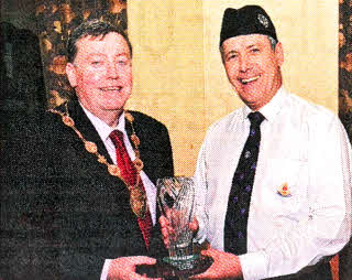 Lisburn Mayor Alderman Paul Porter presents a gift to Uel Mackin (Captain) as a memento of the Mayoral Reception marking the 4Oth Anniversary of the BB Company.