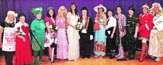 First Lisburn Presbyterian Church PW 'Calendar Girls'. L to R: Molly Redpath (January), Margaret Perry (February), Maureen Staniland (March), Ann Shepherd (April), Elaine Davis (May), Louise McWatters (June), Lorna Collins (July), Evelyn Moffett (August), Deborah Balnave (September), Susie Gilbert (October), Joan McKeown (November) and lrene Richer (December). Included is compere Florence Blair, Easter Chic (right).