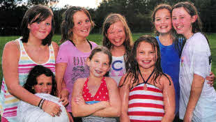 Sophie and Kate-Lynn Blythe and friends wait their turn for the slippery slide