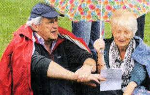 Colin and Moya McLean from Railway Street Presbyterian Church singing off the same hymn sheet.