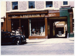 Smyth Patterson Ltd., Timber and Hardware shop in 1957. Pictured outside is Harold�s Austin Ten car, and at the bottom of the entry is the timber yard. The Lisburn city centre shop is now a modern ten-department store.