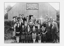 Pictured at The Glad Tidings Mission Hall at the Mills, Dromore in about 1930 are L to R: (front row) Maisie Jackson, Mrs. Magill, Miss Morrell � Missionary, Miss Hearsey, Mrs. Thomas, Mrs. Hunter, Mrs. Miskimmons and Miss Lilley. (second row) Barbara Ireland, Ena Purdy, Sammy Lunn, Minnie Beggs, Madge Miskimmons, Tina Jackson, Willie Purdy, Bobby Baxter, Sam Miskimmons, Evelyn Harvey and Mary Emily Harvey. (third row) Aggie Harvey, Maggie Harvey, Miss Kilpatrick, Maggie Hunter, Minnie McDowell, Mrs. Morrison, Mrs. Taylor and John Beggs. (fourth row) Ella Gibson, May Purdy, Mrs. McGrath, Sam Black, Billy Marshall, Tommy Kerr, Wilfie Taylor and Billy Hunter.