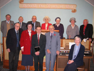 Pictured on Sunday afternoon 6th November 2005, are some of the people that gather for worship each month at Beanstown Mission Hall. L to R: (front) Billy McCleery, Margaret Sharkey, Robert Watson, Wesley Campbell and Rosemary Campbell - Organist. (back row) John Spence, Sammy Law, Harper, Kirkpatrick, Jean Kennedy, Betty Kirkpatrick, Annie McKeown and Jim Reid.
