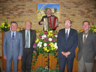 Ballymacbrennan School Hall leaders and guest speaker, pictured at the Harvest Service on Monday evening 6th November 2005. L to R: (front) David Adams, Norman Moore, Desmond Shortt and John Martin. Standing at the pulpit is the Rev. Fred Greenfield - Minister of Newtownards Free Presbyterian Church. In the background is a painting by the late Jack Calderwood, showing a harvest scene.