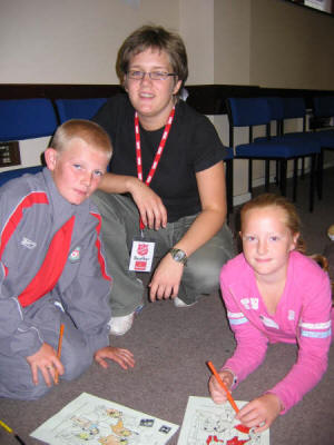 Heather Wright pictured with Dale Gilmore and Megan Vevers at the Salvation Army Holiday Bible Club - 'Be Incredible'. US34-744SP 