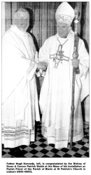 Father Hugh Kennedy, left, is congratulated by the Bishop of Down & Connor Patrick Walsh at the Mass of his Installation as Parish Priest of the Parish of Blaris at St Patrick's Church in Lisburn US40-455CL