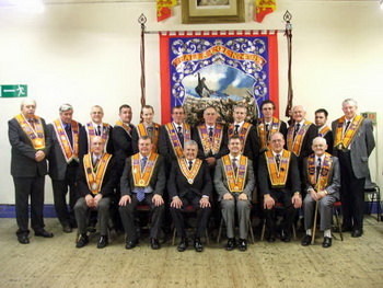L to R: (seated) Bro Tom Wright (County Grand Secretary - Belfast), Bro Connor Gray (Worshipful District Master), The Most Worshipful Robert Saulters (Grand Master), Lagan Valley MP Bro Jeffrey Donaldson MLA and Bro Hugh Moulds (Lodge Treasurer and Deputy District Master) and Bro Alan Campbell (Past Master). (back row) Bro Malcolm Hill (Past District Master), Bro Jim McConnell, Bro Kenneth Moulds (Past Master), Bro Uel Moulds (Past Master), Bro William Moulds, Bro Keith Bennett (Deputy Master), Bro John Crookshanks (Past Master), Bro Gary Campbell (Secretary), Bro Mark Walker, Bro John Campbell (Chaplain), Bro Stuart
