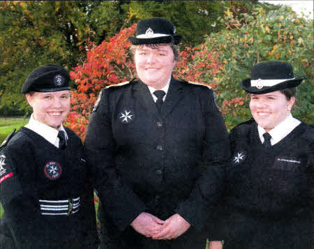 Tracey Elliot (centre) Youth Officer (Eastern Area) for St John Ambulance joins (l-r) Lois and Faith Haffey from the Lisburn Q Division at a recent St John Ambulance Awards ceremony held in Hillsborough Castle. Lois and Faith were awarded a certificate for completing the Grand Prior Award. This is presented to those who complete 24 Cadet Subjects.