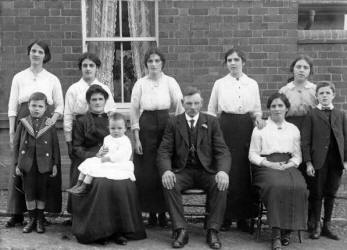 This excellent 1915 photo of the Campbell family shows Wesley Campbell, age 2, sitting on his mother’s knee.