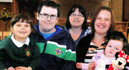 Linda Hamilton with her son Colin, daughter-in-law Lynsey and grandchildren Jessica and baby Danielle at a Coffee Morning in aid of Cancer Research at Derryvolgie Parish Church on Friday 18th May