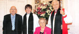 The new rector Joanne Megarrell with her family.