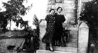 An early photograph outside the Ulster Tower, Thiepval, France- Lisburn lady, Maisie Richardson, step-daughter of William McMaster, is pictured on the right.