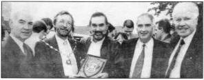 Former mayor Seamus Close presents George with a borough plaque during his visit to the Groove Activity Centre. Looking on are left, councillor Ivan Davis, Jim Emery and Greg Ferris. US48-921SP.