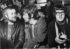 Pictured at a Folk Club in the Red Rooster Caf� in 1967 is L to R: John Kelly (centre of picture) and Davy Davis, better known at TC (Top Cat).  Behind them is Jackie Graham and his now wife Pauline.  Unfortunately we do not know the name of the person on the left, but an email from Australia identifies the two people in the background as Gerry Hughes and Ronnie Williamson.