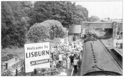 The steam train stops at Lisburn to pick up some of the last passengers to travel along the Lisburn to Antrim line on Sunday. US27-755SP