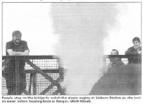 People stop on the bridge to watch the steam engine at Lisburn Station as she took on water before heading back to Bangor. US36-602JC