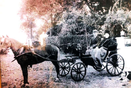 Robert Petticrew, who was for many years a jeweller in Bow Street, pictured at the family farm in Boardmills with his mother in the 19th century. The shop is now the Edinburgh Woolen Mill.