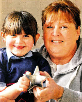 Caitlin Finley, age 4, from Belsize Road, who received the Ulster Cancer Foundation's Little Star award after being nominated by next door neighbour Lynn Johnston. US0212.529cd