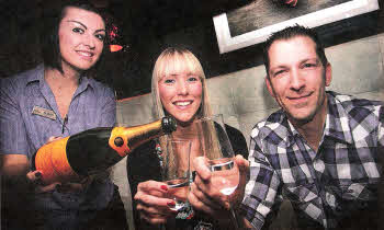 Alison Shaw of The Tannery pours a drink for Maeve Fox from the Ulster Cancer Foundation and Andrew Holden of the Plough Hillsborough promoting the Dine and Dance Event at the Tannery in Mein on 18th May in aid of the Ulster Cancer Foundation. US1812-107A0