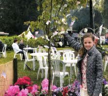 Beth Murtagh from Lisburn, aged 10, ties a butterfly on the tree to support organ donation. Her father Jim, signed the organ donor register.