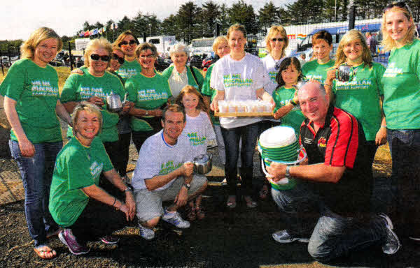 Record breakers...on the way to beating the record for most hot dogs made in a minute.