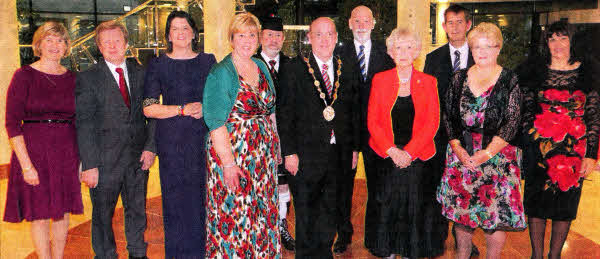 he Top Table pictured at the Mayor's Civic Dinner (I-r) Mrs. Dark; Reverend Dark; Enterprise Minister, Mrs. Arlene Foster; Mayoress Mrs. Kathleen Leathern; Piper, Mr Billy Jackson; Alderman William Leathern; Chief Executive, Mr Norman Davidson; Lord Lieutenant, Mrs. Joan Christie; Health Minister, Mr Edwin Poots; Deputy Mayor, ClIr. Margaret Tolerton and Mrs. Glynis Poots.