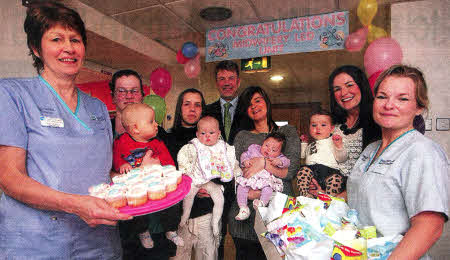 The Chief Executive of the South Eastern Trust, Mr Hugh McCaughey, and staff from the Lagan Valley Hospital) Midwife-led Unit celebrate the unit's first anniversary. US1412-121A0