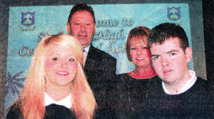Mr Darragh with Ms Jordan Principal presenting Natalie Mc Caherty and Jamie Petticrew with the Extra Curricular Awards