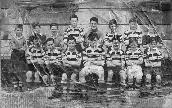 Back Row L-R Gerald Stewart, Elias McCutcheon, Malachy Fitzsimmons, Joe O'Hagen, Francie Morgan, Oliver O'Neill, Paul McKeown, Ignatius Brown - Front Row L-R Ken Burns, Gerald Skelton, Brendan Skelton, Gerald Murray, Francie Dennison, Eamon O'Gorman, Russell Bell.